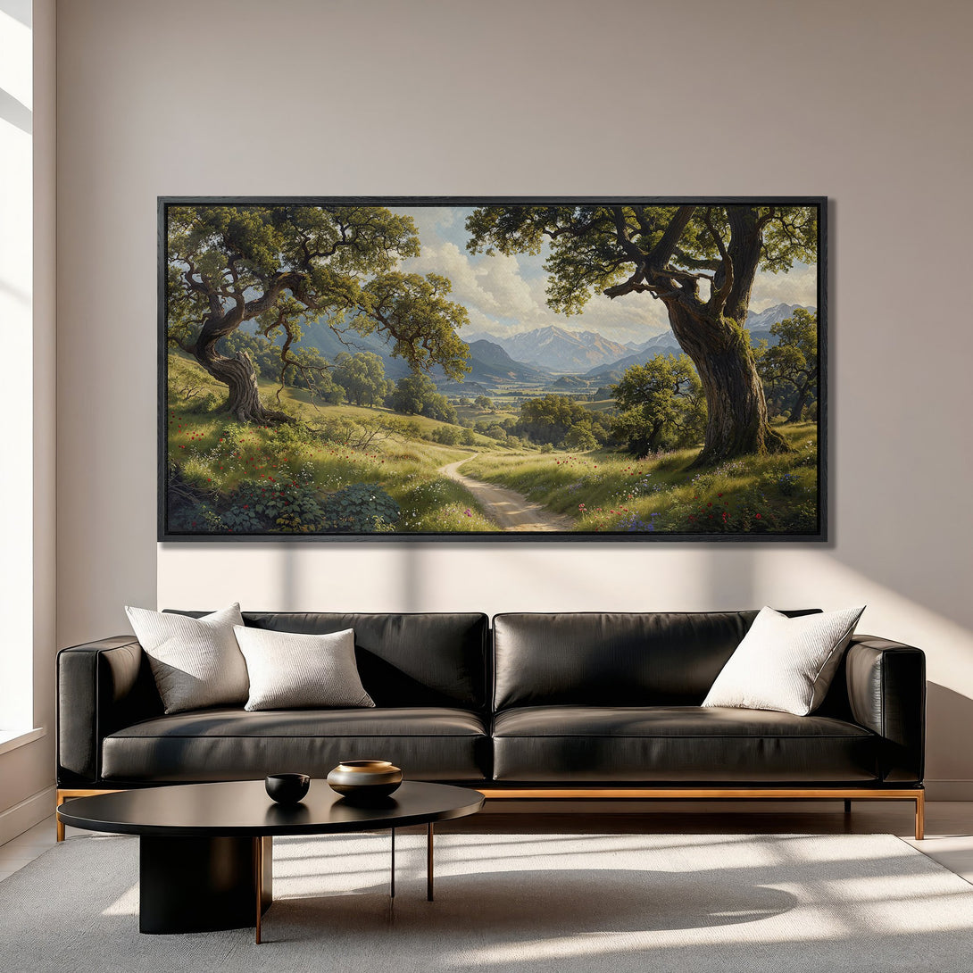 Framed Wall Art: Landscape Canvas Print of a serene meadow with trees, mountains, and a path. Earthy tones of green, brown, and blue. Perfect for home decor.