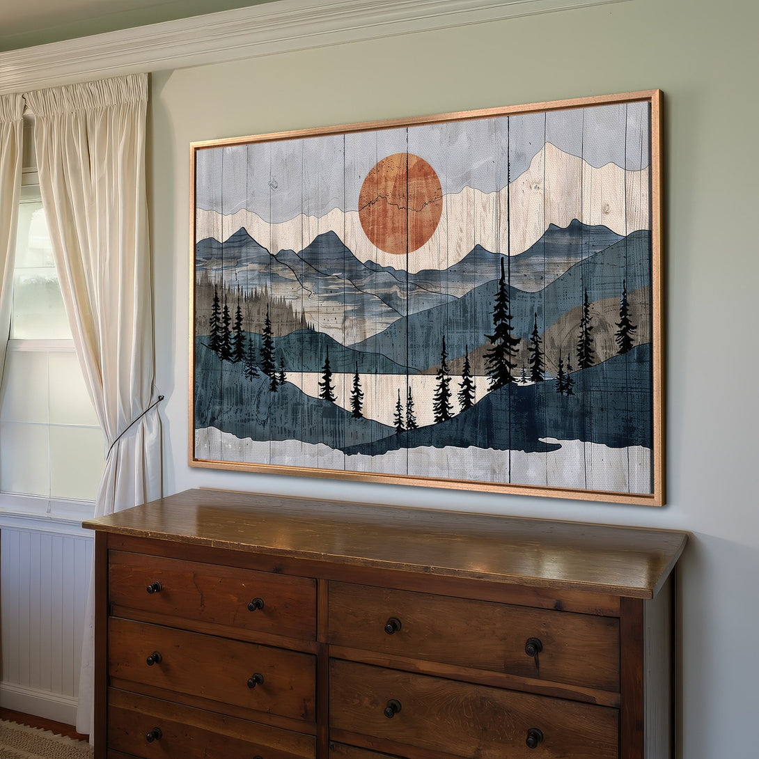 Framed Wall Art featuring a mountain landscape with a sunset, in a rustic style with blue, gray, and orange tones. Perfect for home decor.