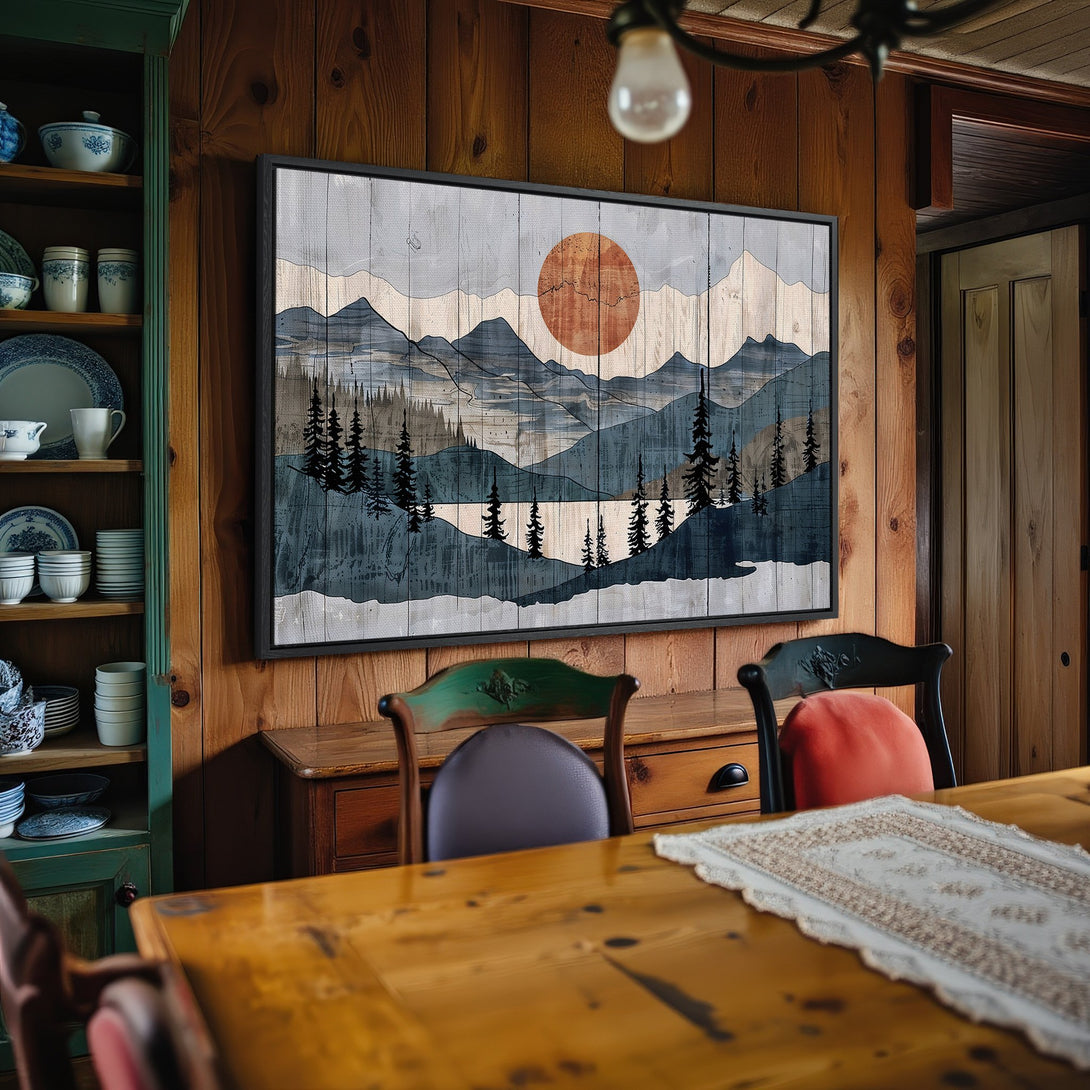 Framed Wall Art: Mountain landscape Canvas Print in a rustic interior. Features a sunset, blue and gray color palette, and a distressed wood aesthetic.