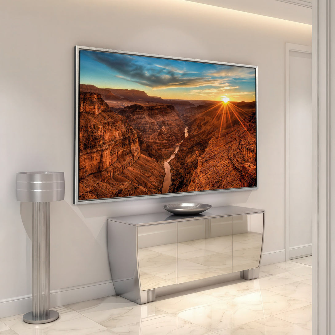 Framed Wall Art of a Grand Canyon sunset. Dramatic landscape art with warm orange, brown, and blue hues. Elevate your home decor with this stunning Canvas Print.