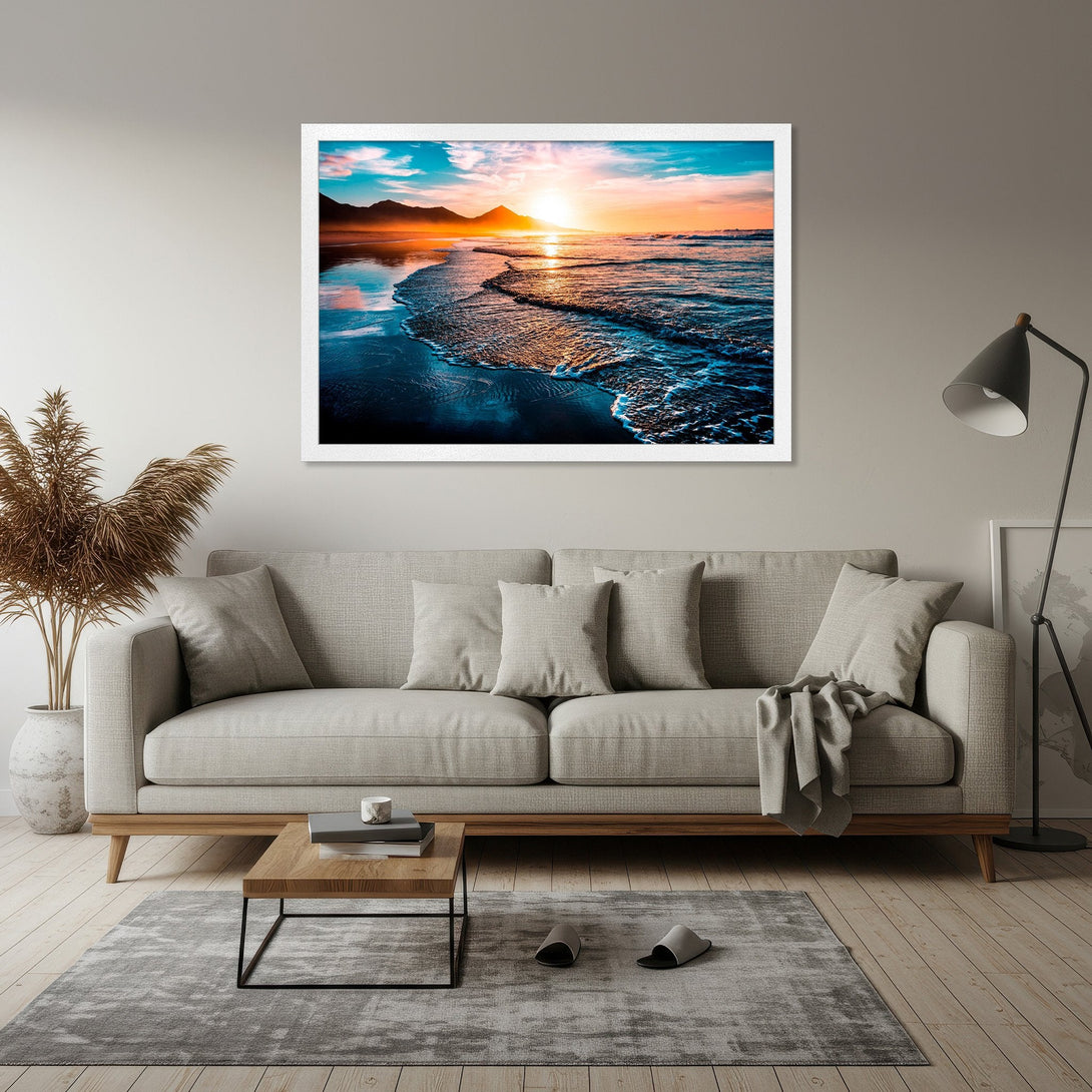 Framed Poster of a sunset over the ocean. Coastal art print with vibrant blues, oranges, and teal. Perfect for home decor.