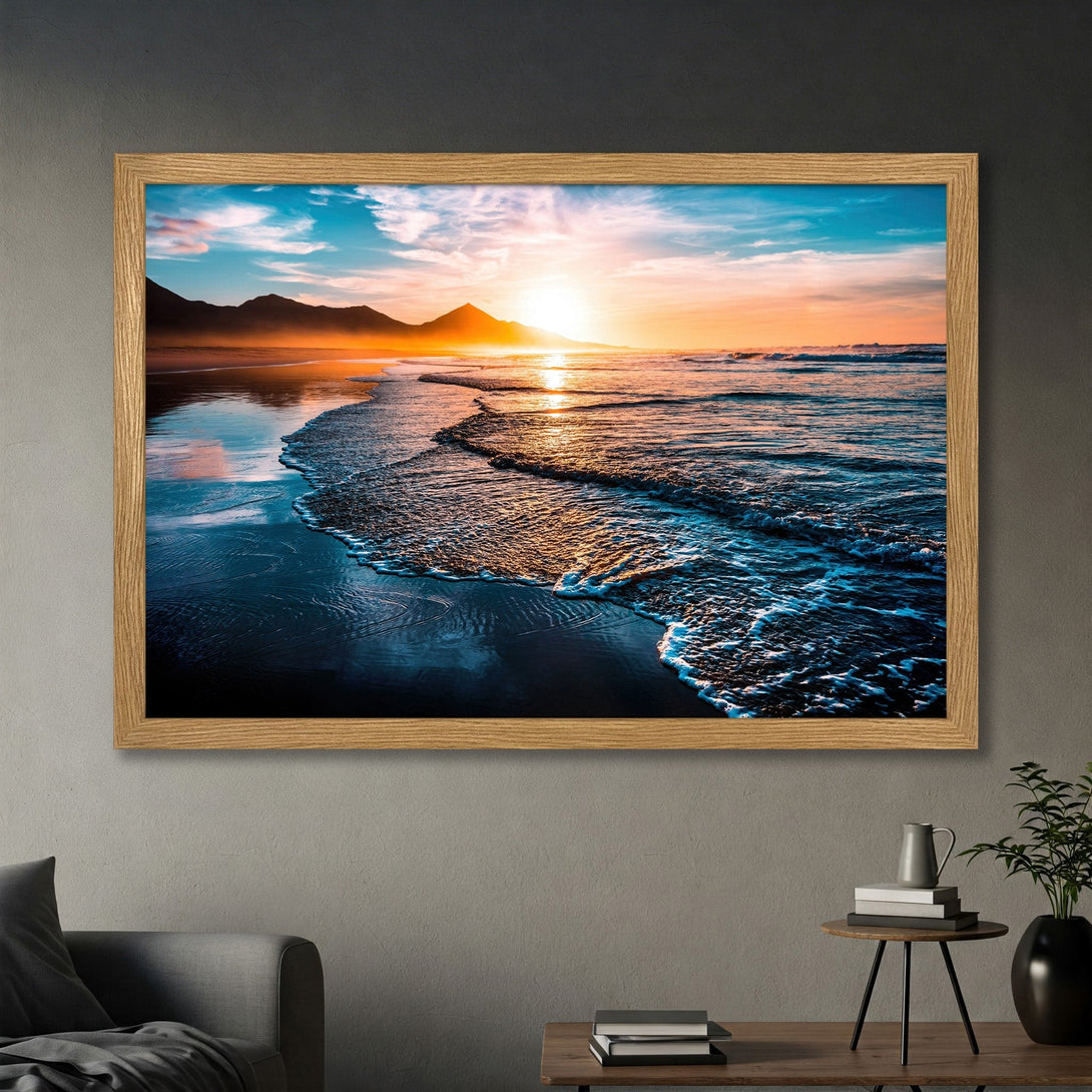 Framed Poster featuring a vibrant sunset over the ocean. Coastal art in a warm color palette of blues, oranges, and yellows. Perfect wall decor.