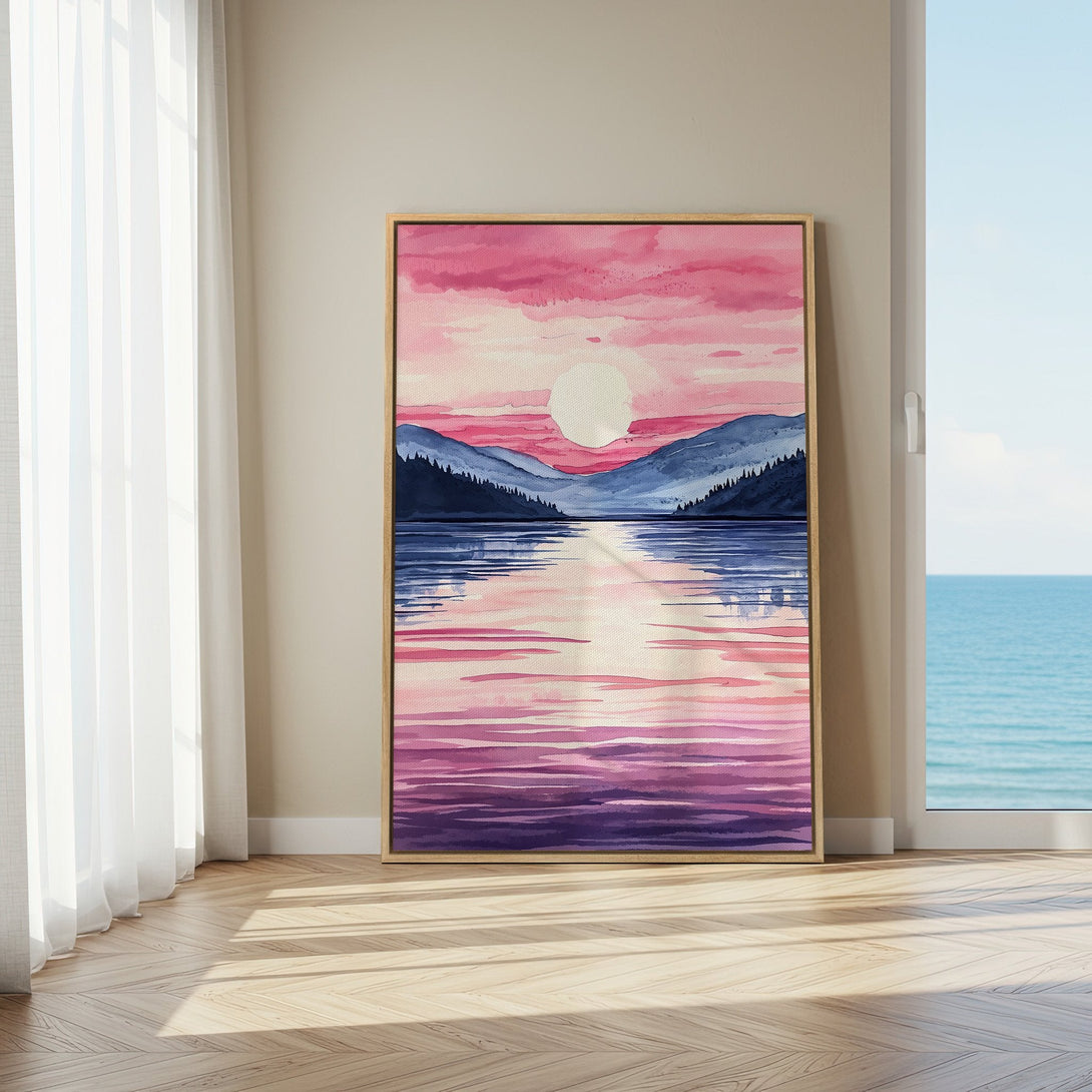 Framed Wall Art featuring a watercolor landscape with a pink and purple sunset over a lake. Adds a touch of serenity to any room.