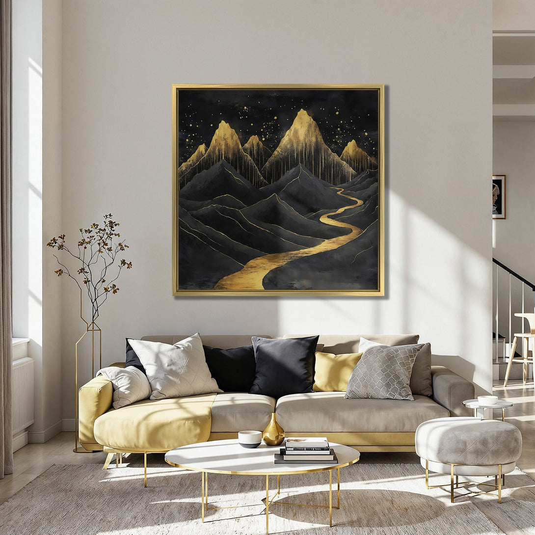 Canvas Print of abstract mountain landscape in black and gold, shown in a stylish interior with red chairs and teal walls.