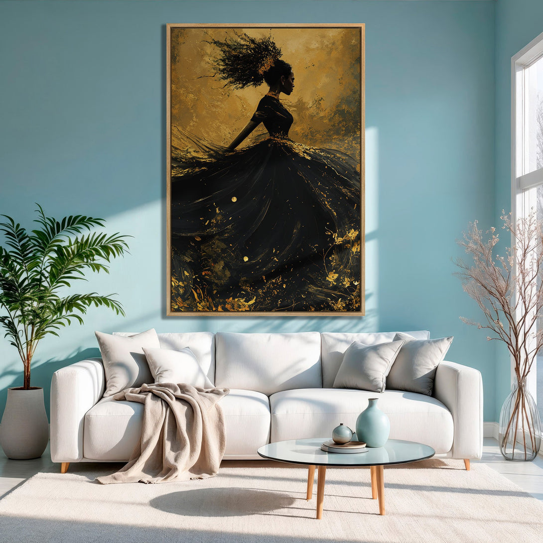 Framed Wall Art: Abstract black and gold canvas print of a woman in a flowing dress. Stunning artwork for modern home decor, featuring a gold and black palette.