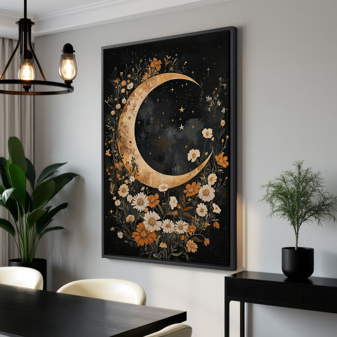 Framed Wall Art: Celestial moon and floral canvas print in a modern interior. Black, gold, and white color palette. Perfect for adding a touch of elegance.
