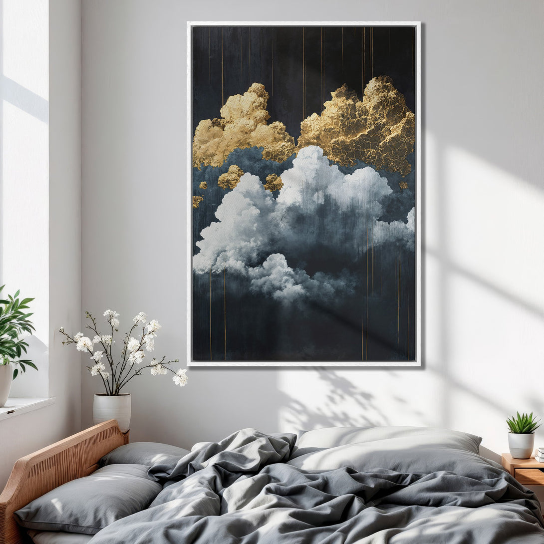 Framed Wall Art featuring abstract gold and white clouds against a dark background. Modern art in a bedroom with a calming, neutral color palette.