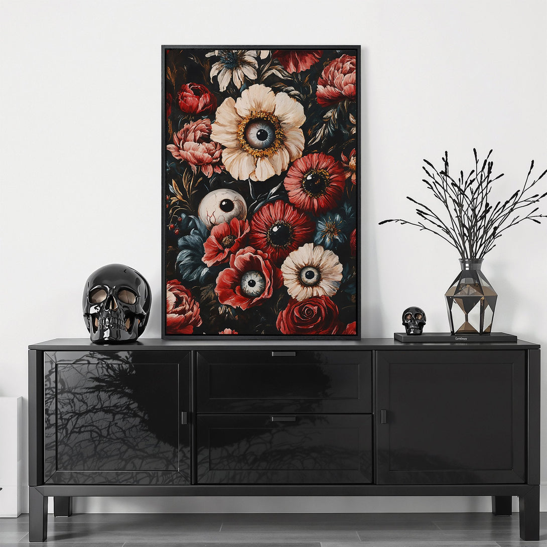Framed Wall Art featuring a dark floral design with eyes, in a gothic style, with a moody red, black, and cream color palette. Perfect for adding a unique touch.
