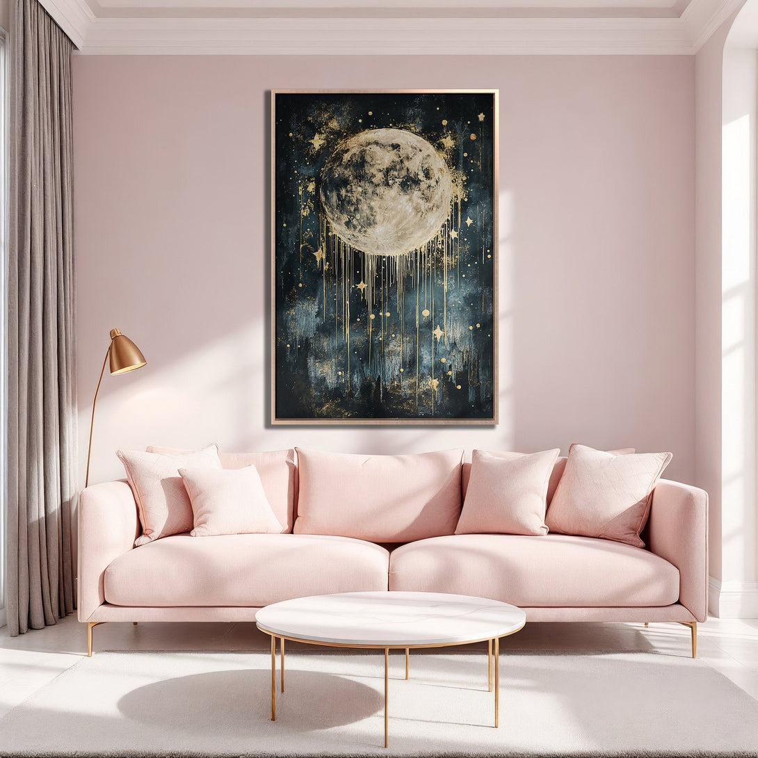 Framed Wall Art featuring a celestial moon design in a dark teal and gold color palette, displayed in a blush pink interior.