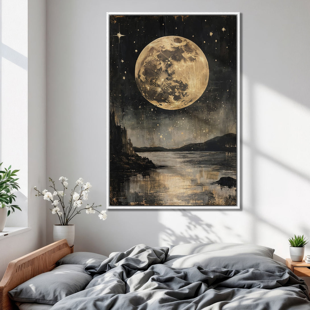 Framed Wall Art featuring a celestial landscape with a large moon, stars, and water. Moody, artistic style in a black, gold, and gray color palette.