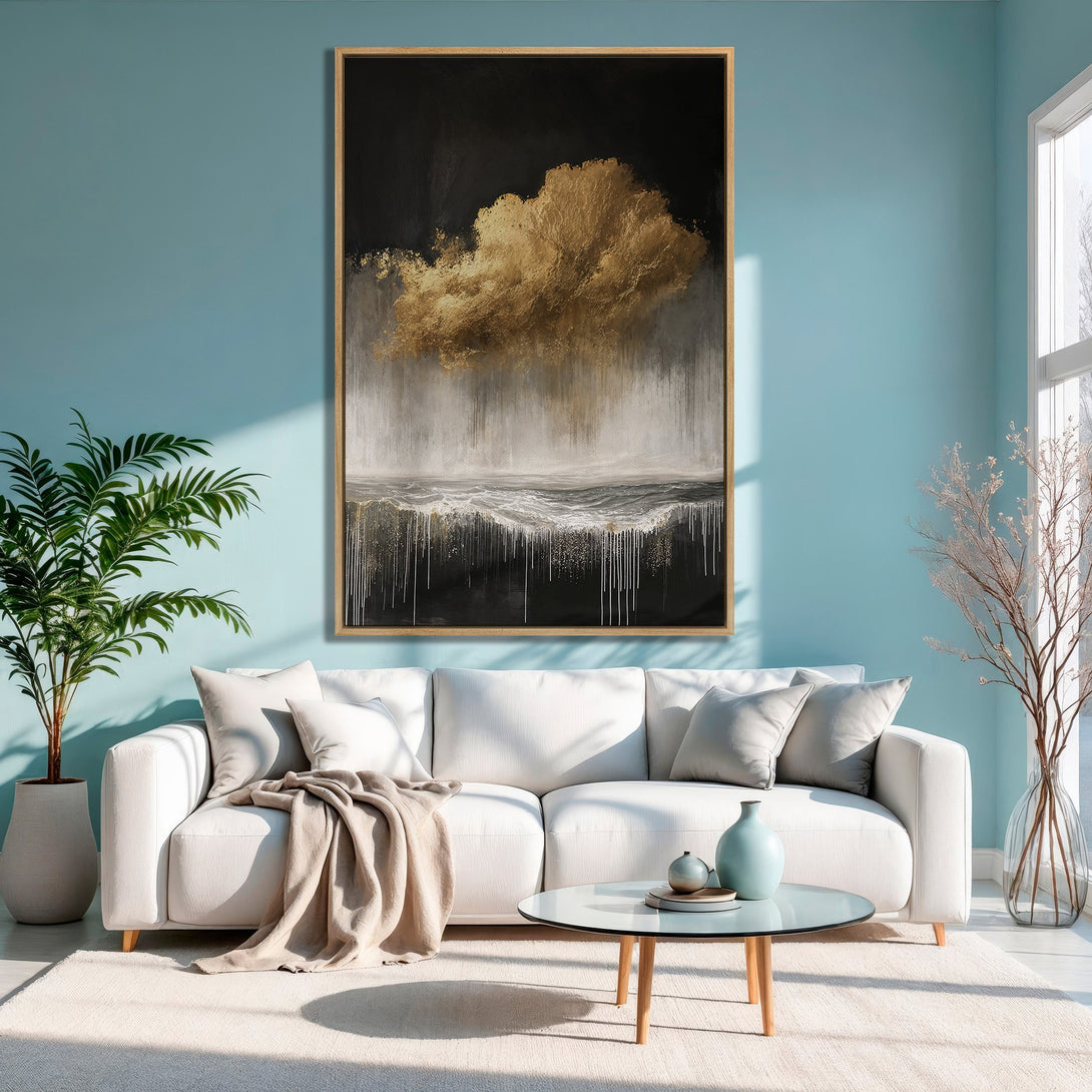Framed Wall Art: Abstract gold cloud painting in a modern living room. Features a black, white, and gold color palette, perfect for adding elegance.
