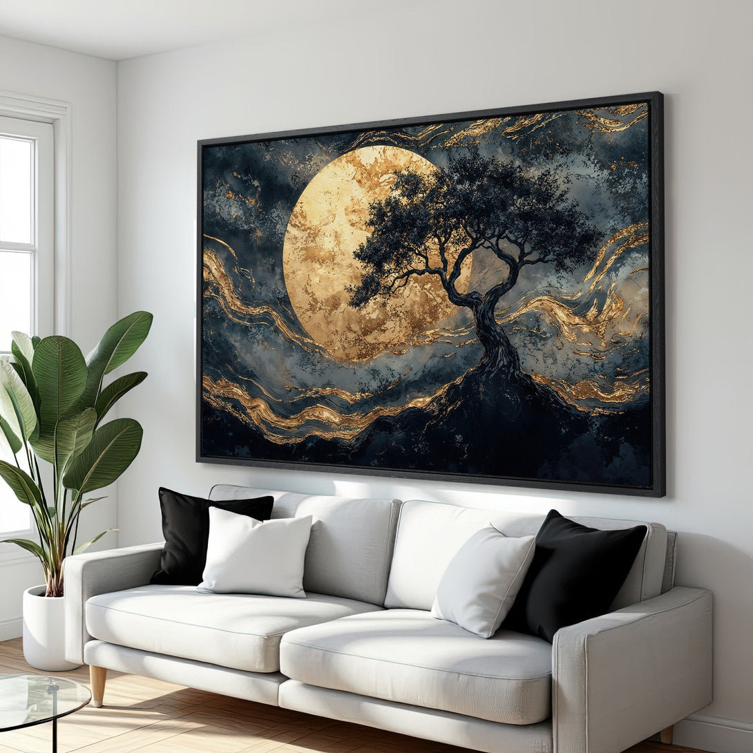 Framed Wall Art featuring a tree silhouette against a golden moon. Modern abstract style with a dark, gold, and teal color palette. Perfect for home decor.