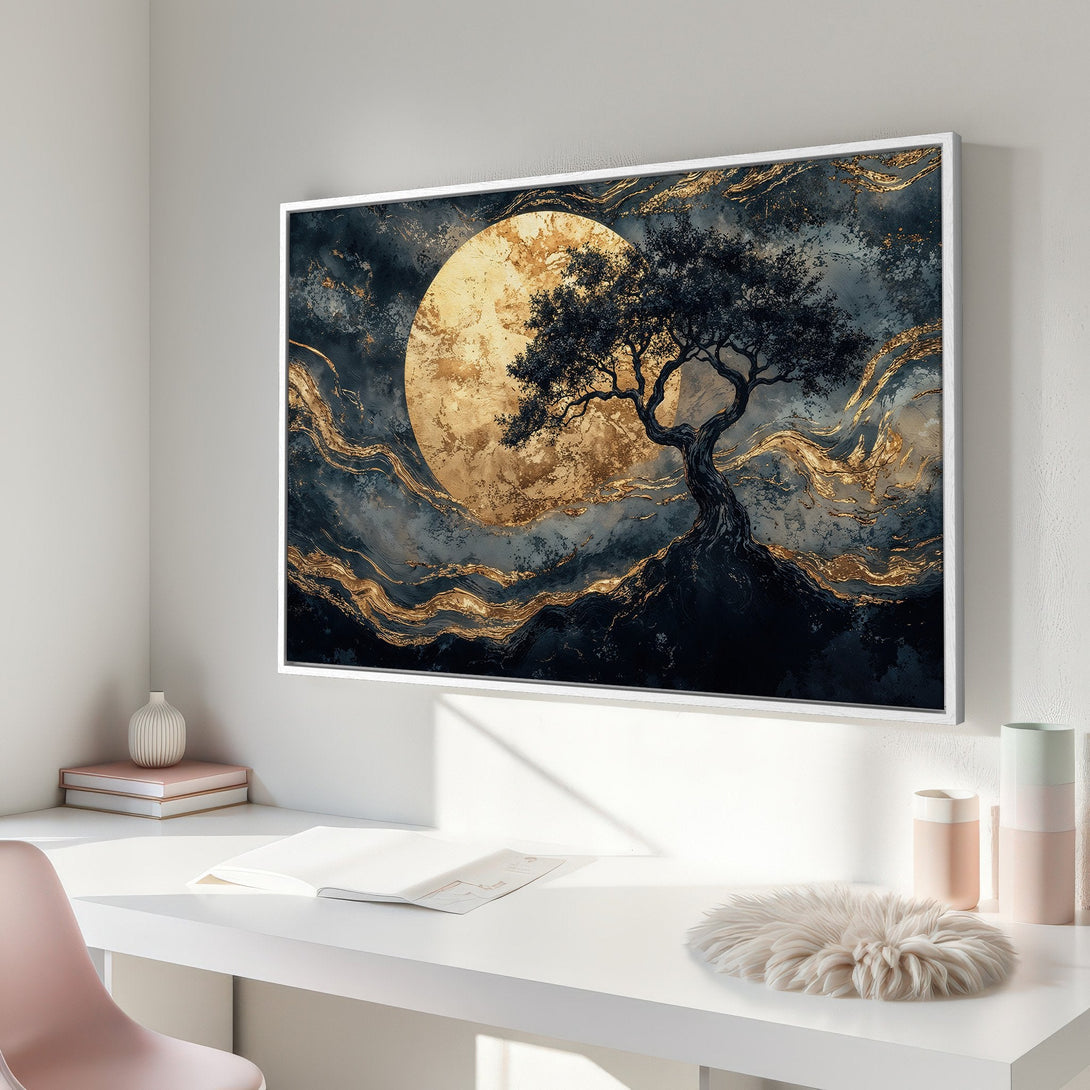 Framed Wall Art featuring a tree silhouette against a golden moon. Abstract style with a moody, dark blue and gold color palette. Perfect for modern decor.