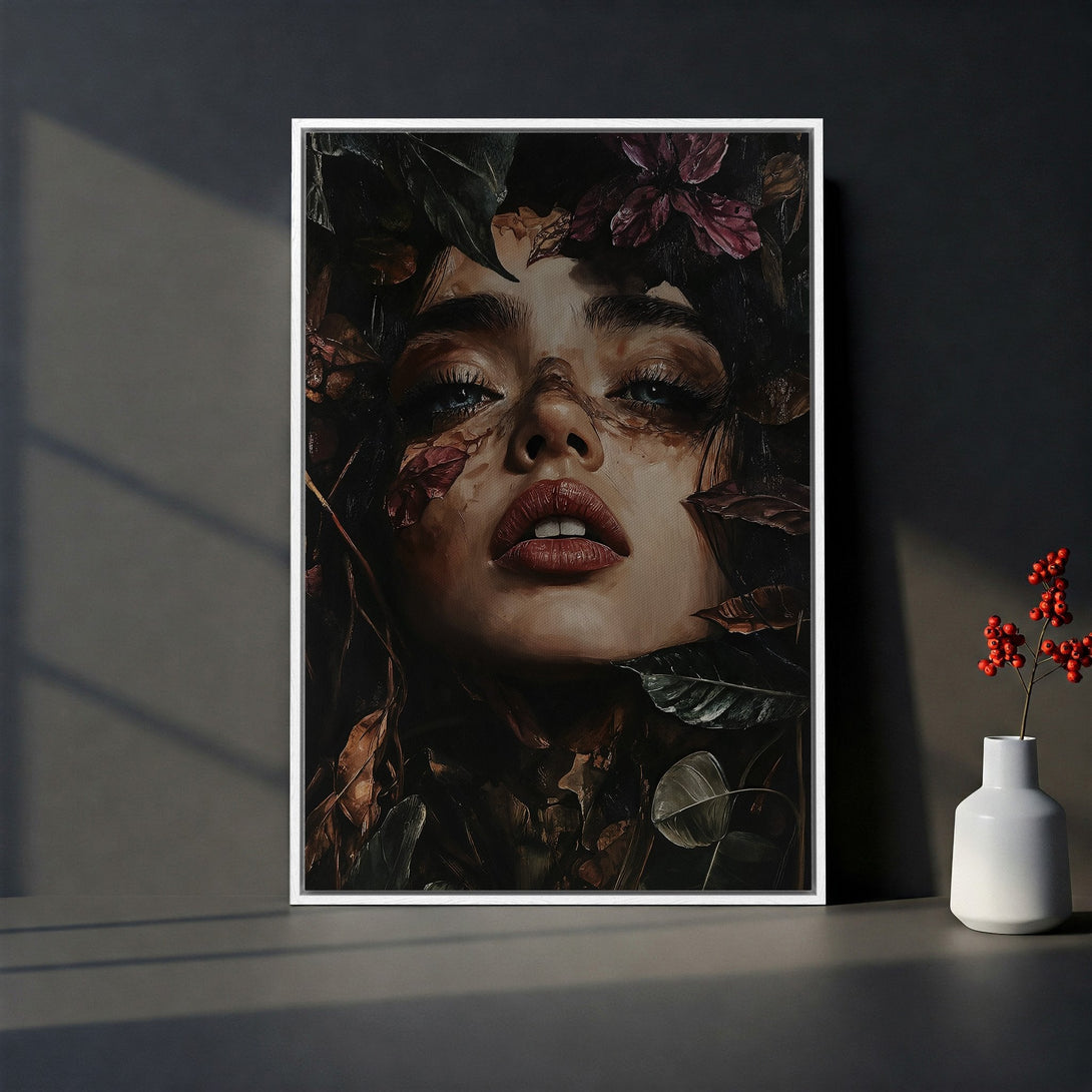 Framed Wall Art featuring a woman's face surrounded by leaves, with a dark, moody color palette. Perfect for adding artistic flair to your space.