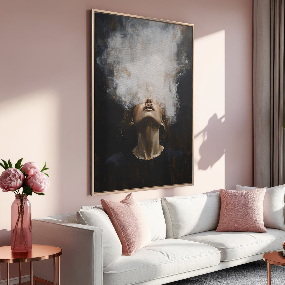 Framed Wall Art: Abstract portrait Canvas Print in moody tones, featuring a woman's face and smoke. Soft pink and neutral color palette for a calming interior.