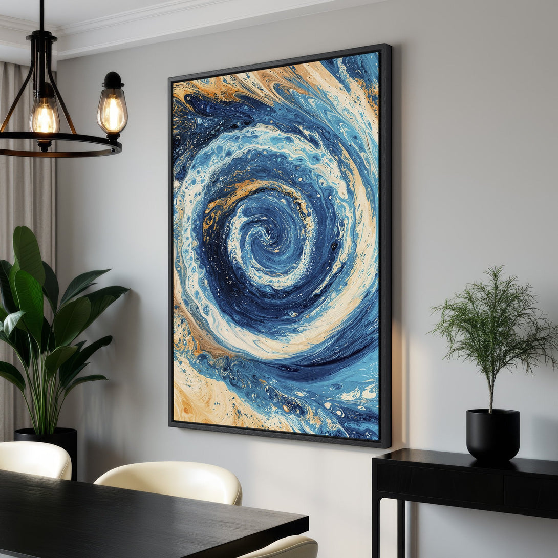 Framed Wall Art featuring an abstract swirl design in blue, white, and gold tones. Modern art piece for a stylish home.