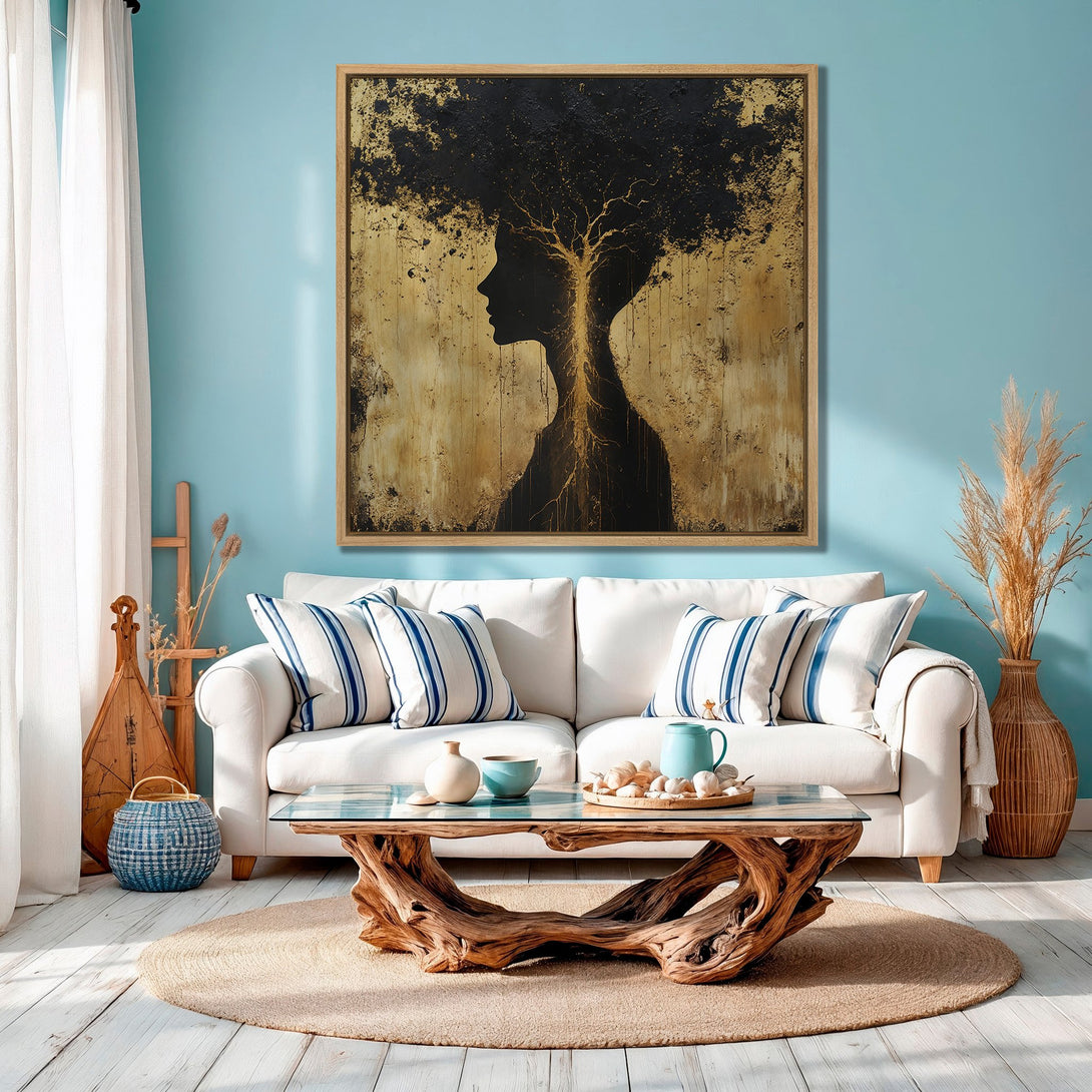 Framed Wall Art: Abstract silhouette canvas print in gold and black, displayed in a coastal-style living room with a blue color palette.