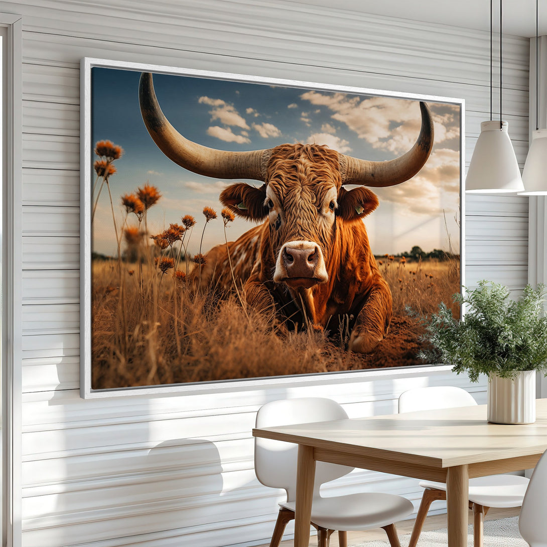 Framed Wall Art: Majestic longhorn canvas print in warm earth tones. Rustic decor featuring a stunning bull in a field, perfect for adding a touch of nature to your home.