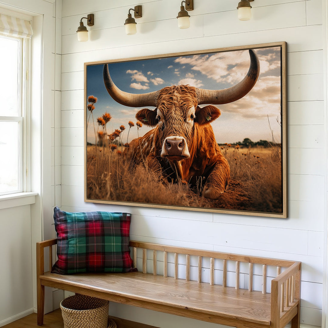 Framed Wall Art: Rustic canvas print of a longhorn bull in a field. Warm, earthy tones create a cozy, farmhouse style. Perfect for country decor.