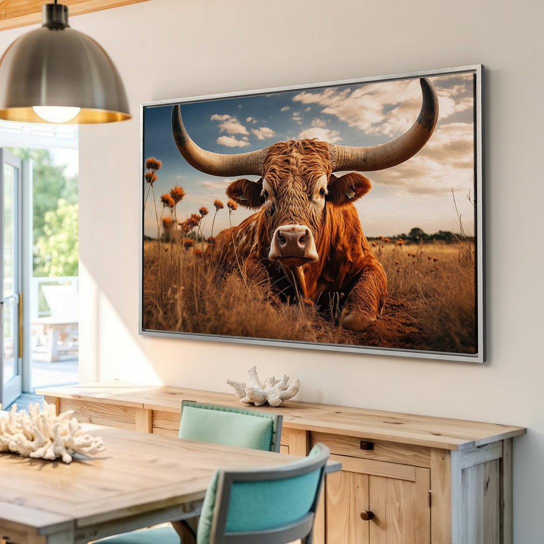 Framed Wall Art of a majestic longhorn bull, displayed in a warm, inviting interior. Earthy tones and a rustic style create a cozy atmosphere. Perfect for home decor!