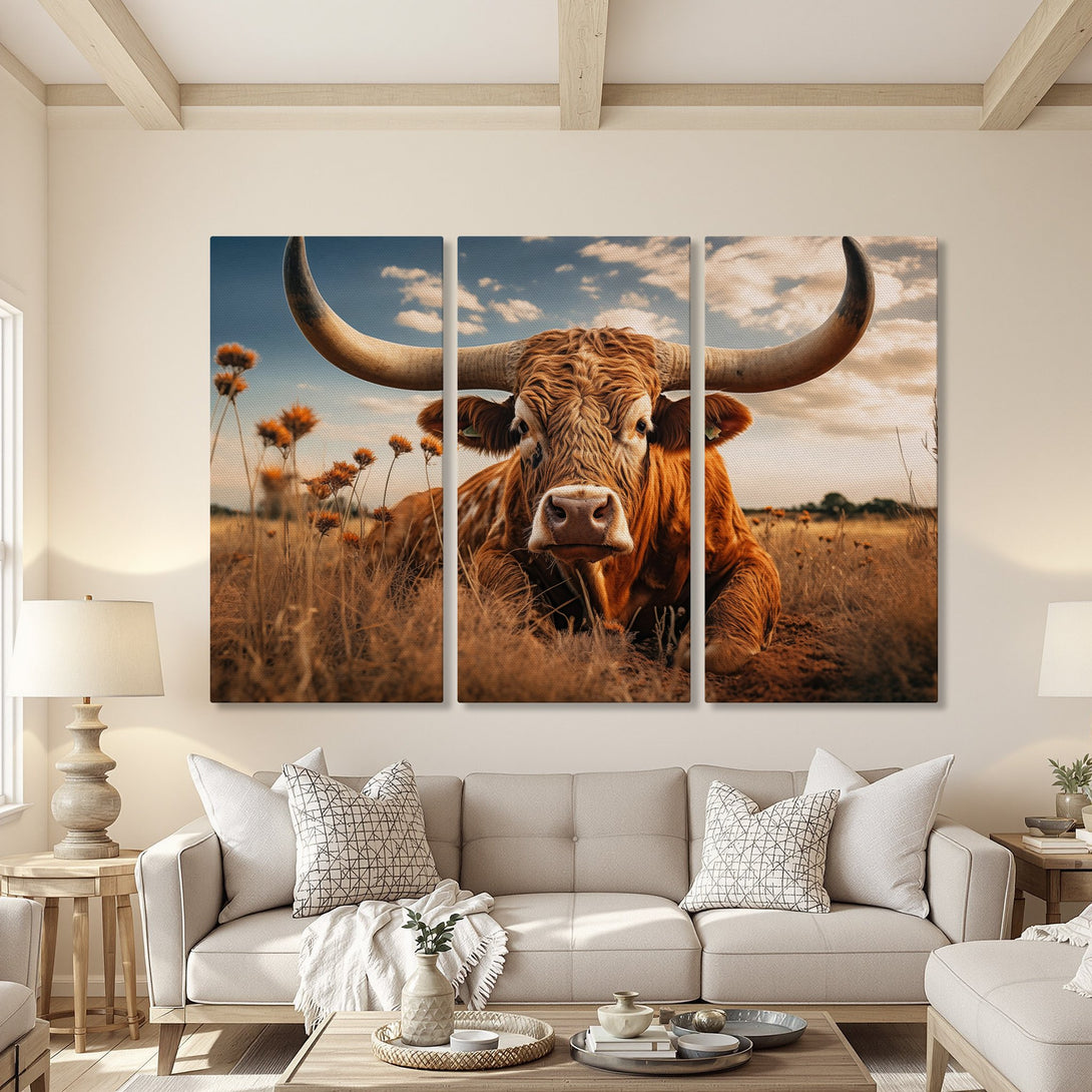 Canvas Print of a Texas Longhorn in a field, warm earth tones. Rustic style wall art for a cozy living room.