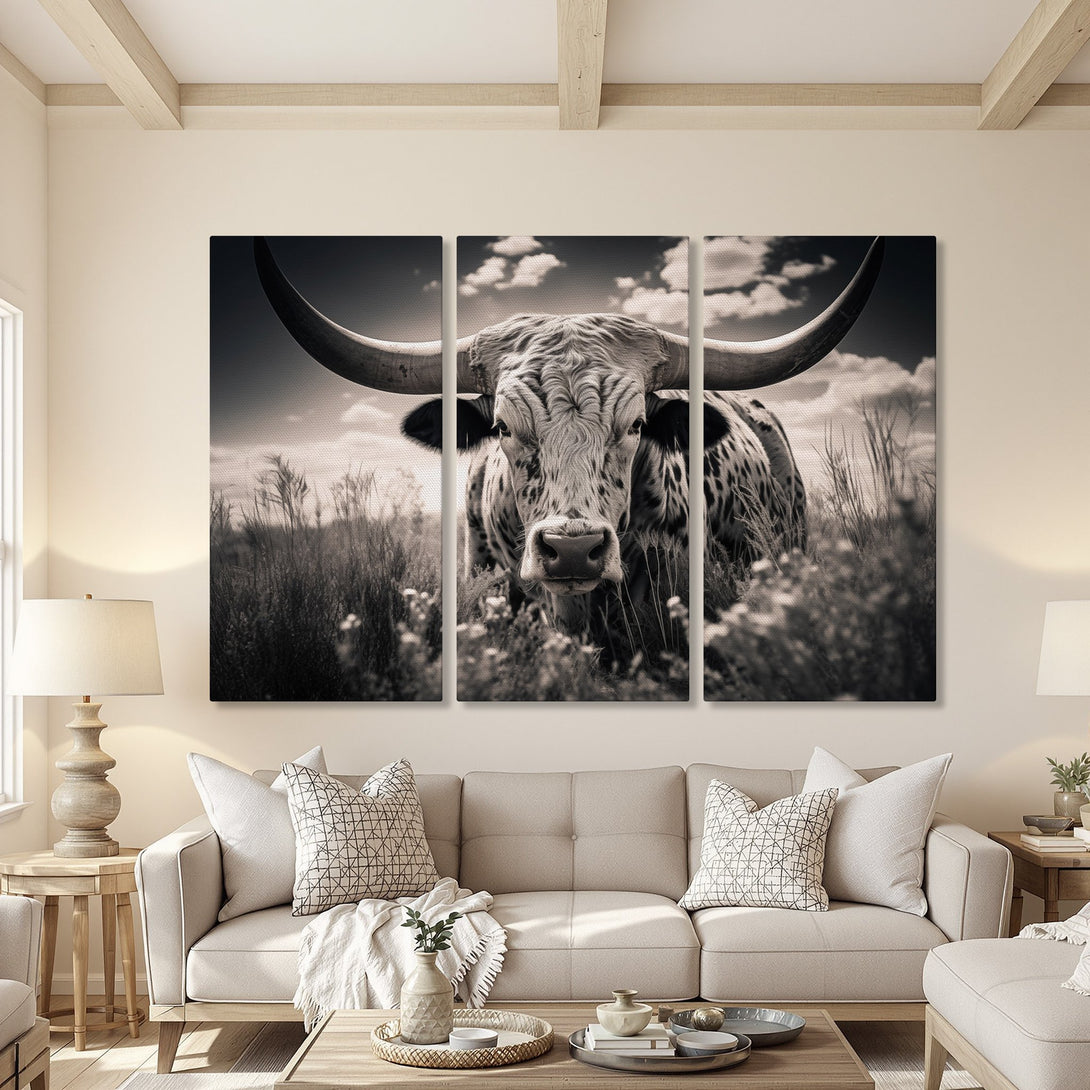 Canvas Print of a majestic longhorn bull in a field, presented in a triptych. Black and white photography style, perfect for rustic decor.