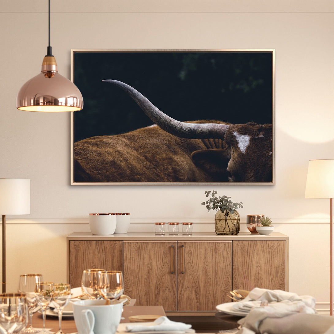 Framed Wall Art featuring a close-up of a longhorn in warm brown tones. Rustic style canvas print adds a touch of nature to any interior.
