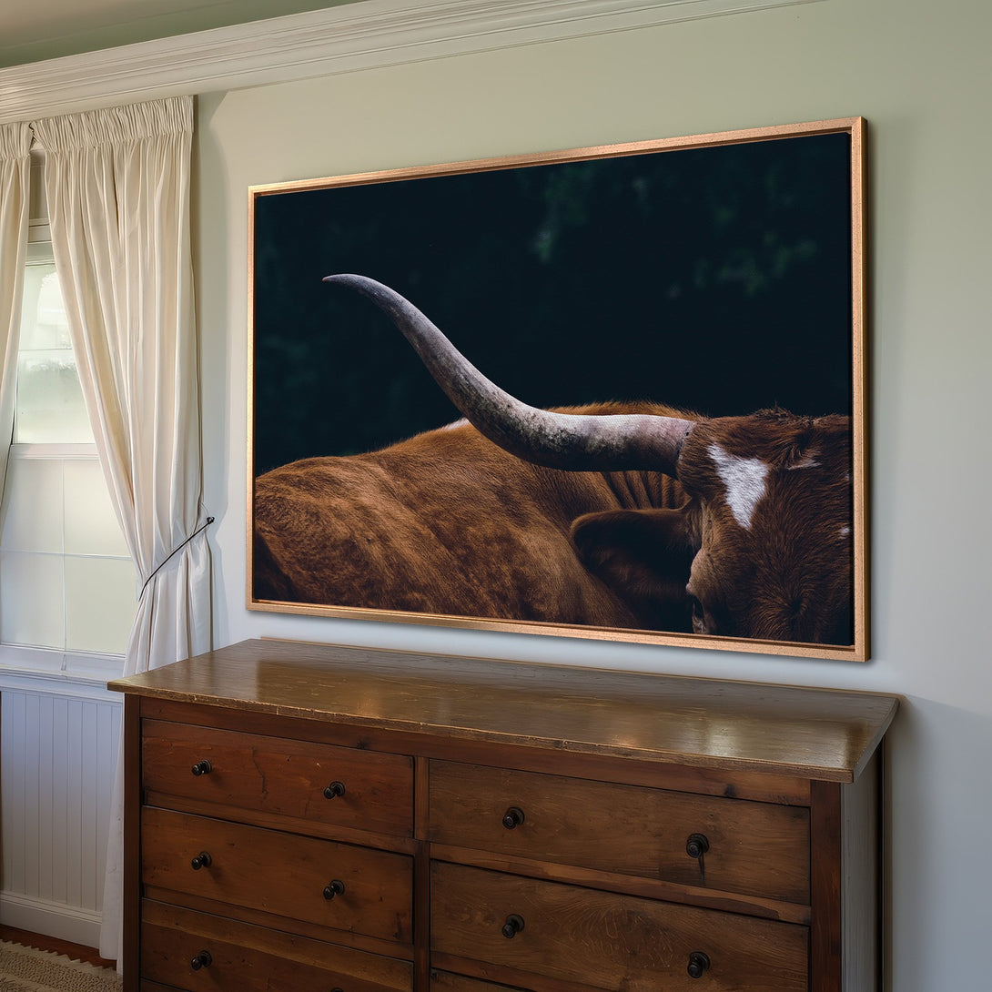 Framed Wall Art: Rustic longhorn canvas print in warm brown tones. Adds a touch of nature and style to any home decor. Shop now for unique wall art!