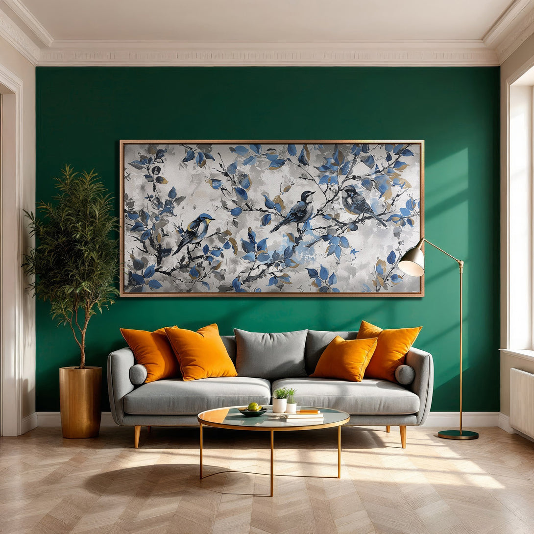 Framed Wall Art: Bird painting in blue & gray tones. Modern living room decor with green wall, gray sofa, and orange accents.