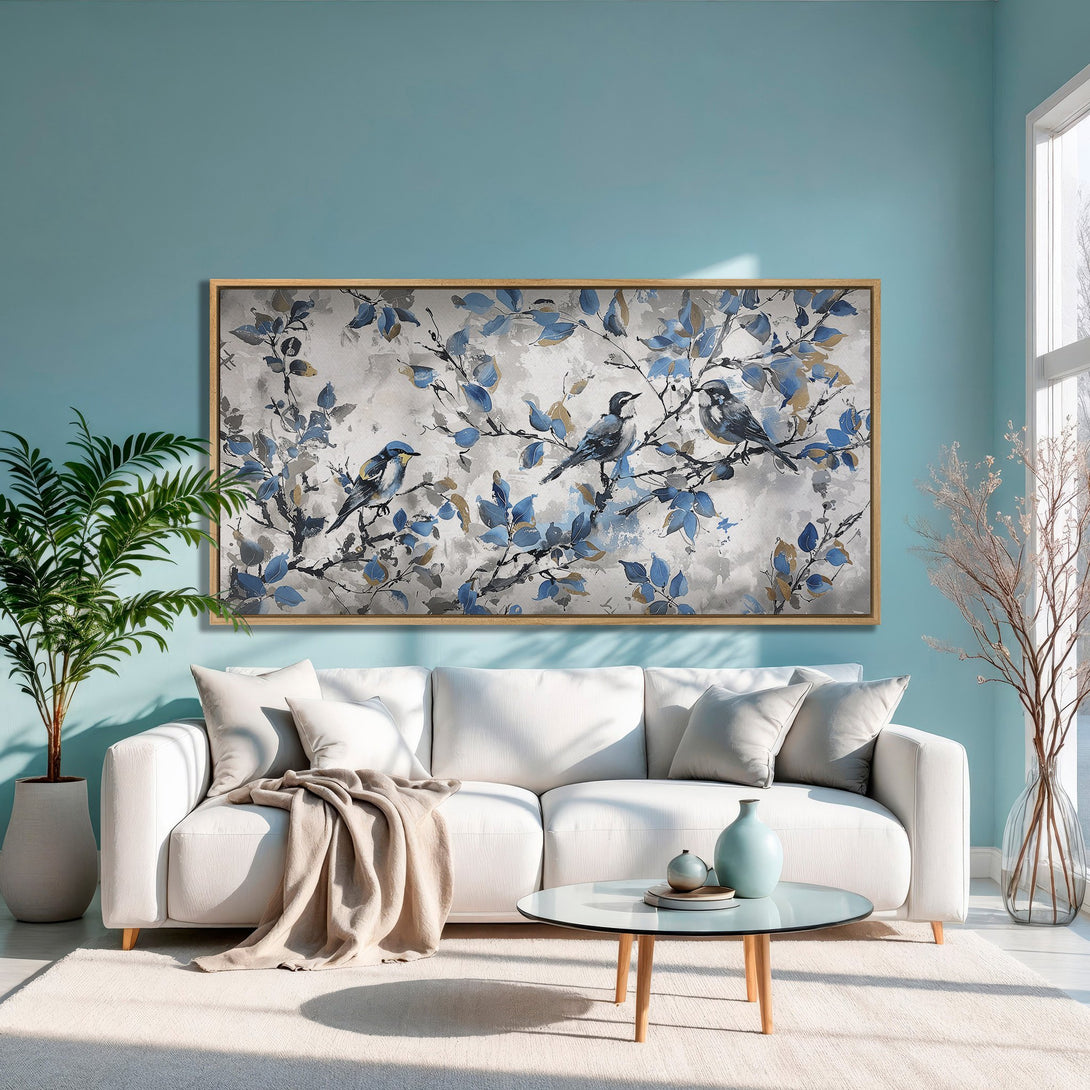 Framed Wall Art featuring birds on branches in a watercolor style with blue, gray, and gold tones. Perfect for adding a touch of nature to your home!