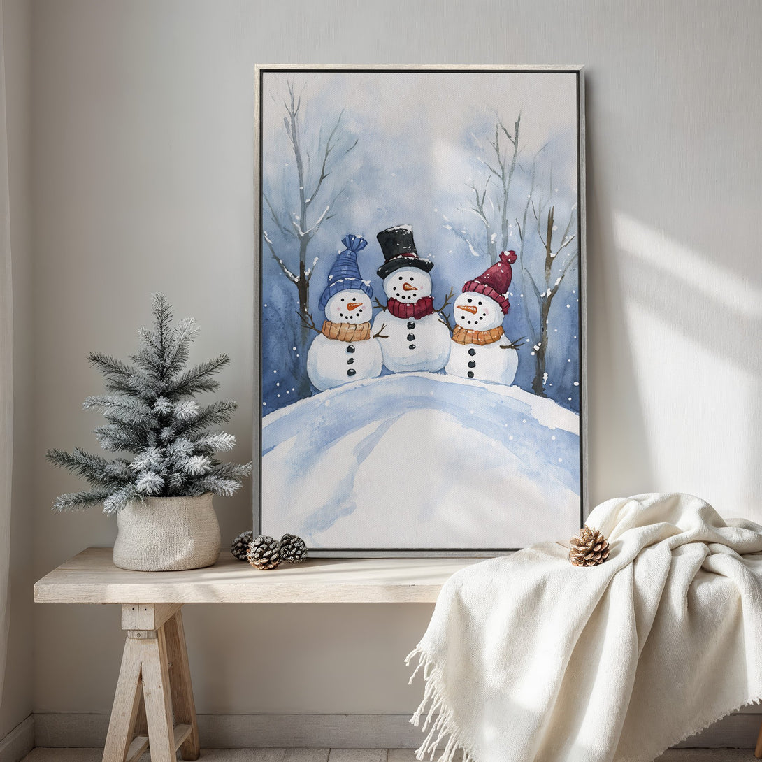 Framed Wall Art featuring watercolor snowmen in a winter scene. Beautiful blue and white color palette. Perfect holiday decor!