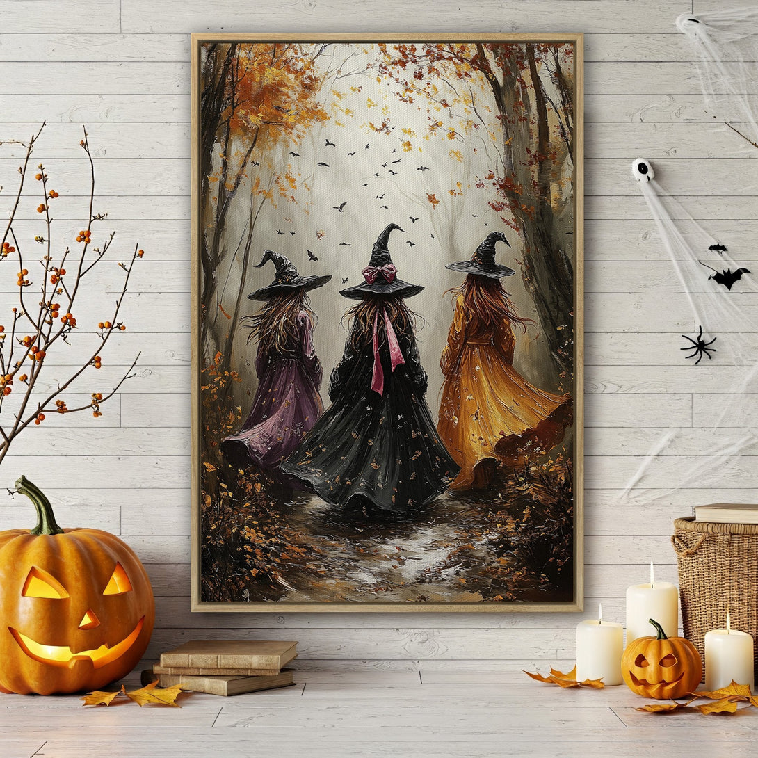 Framed Wall Art: Three witches walking in a fall forest. Warm autumn color palette with orange, brown, and purple hues. Perfect Halloween decor.