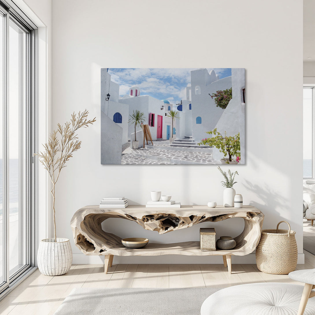 Framed Wall Art: Mediterranean village scene in white, blue, and pink. Bring a touch of paradise to your home with this stunning canvas print!
