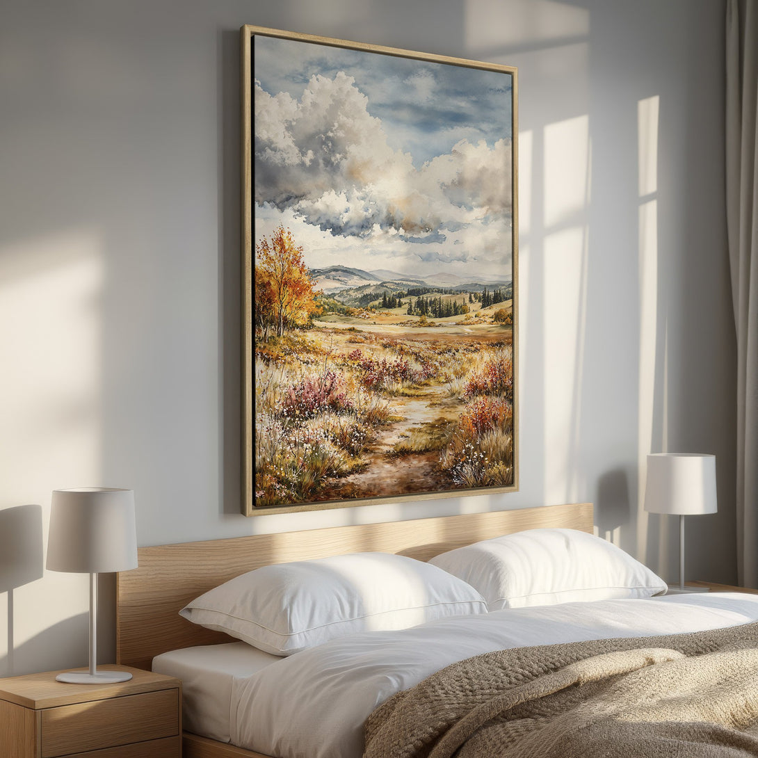 Framed Wall Art: Watercolor landscape Canvas Print with warm autumnal colors, perfect for bedroom decor. Features a serene meadow scene with a cloudy sky.