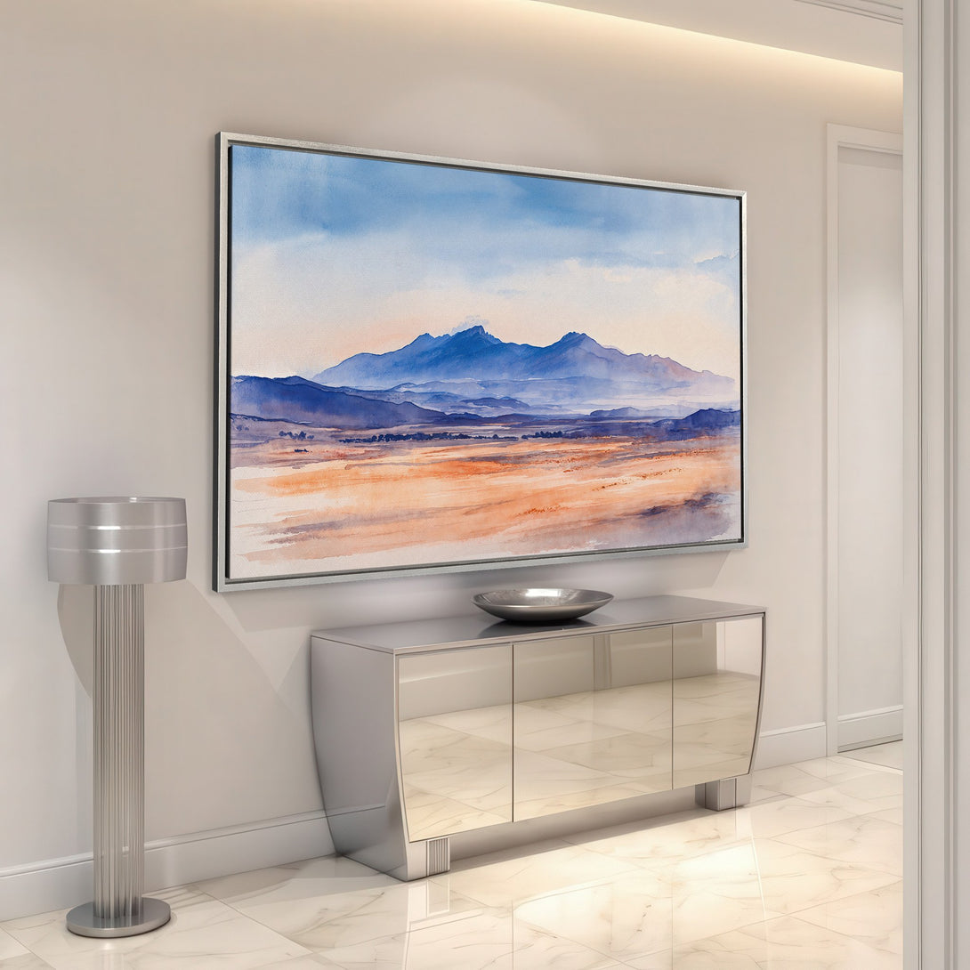 Framed Wall Art featuring a watercolor landscape with blue mountains and warm earth tones, perfect for adding a touch of nature to your home decor.