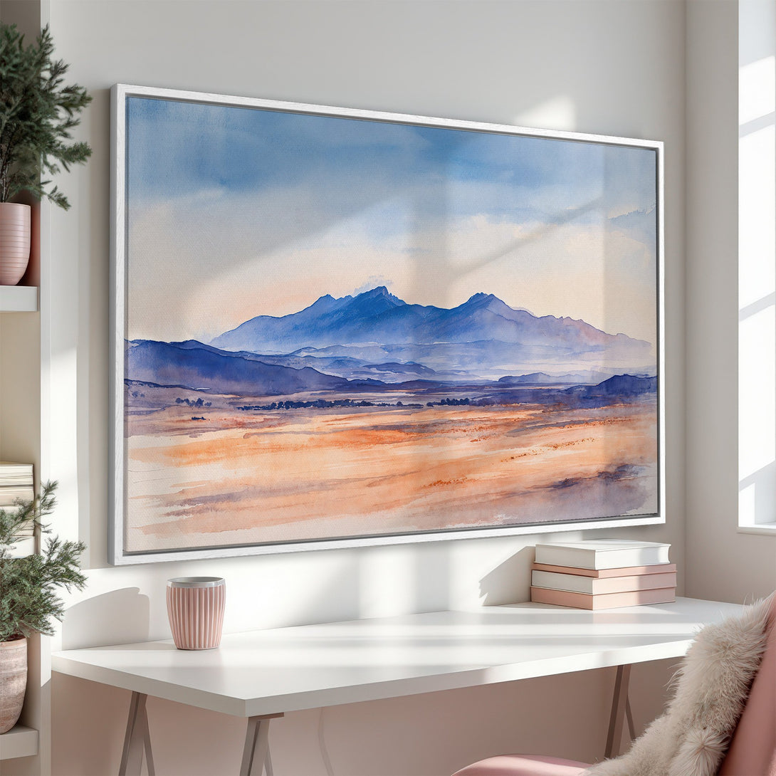 Framed Wall Art of a watercolor landscape with mountains in blue tones. Enhance your space with this serene Canvas Print, featuring a warm, inviting palette.