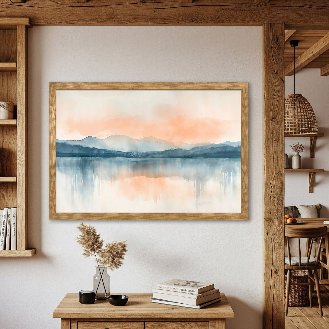 Framed Poster featuring a watercolor landscape of mountains and water. Soft blue, orange, and neutral color palette for a calming aesthetic.