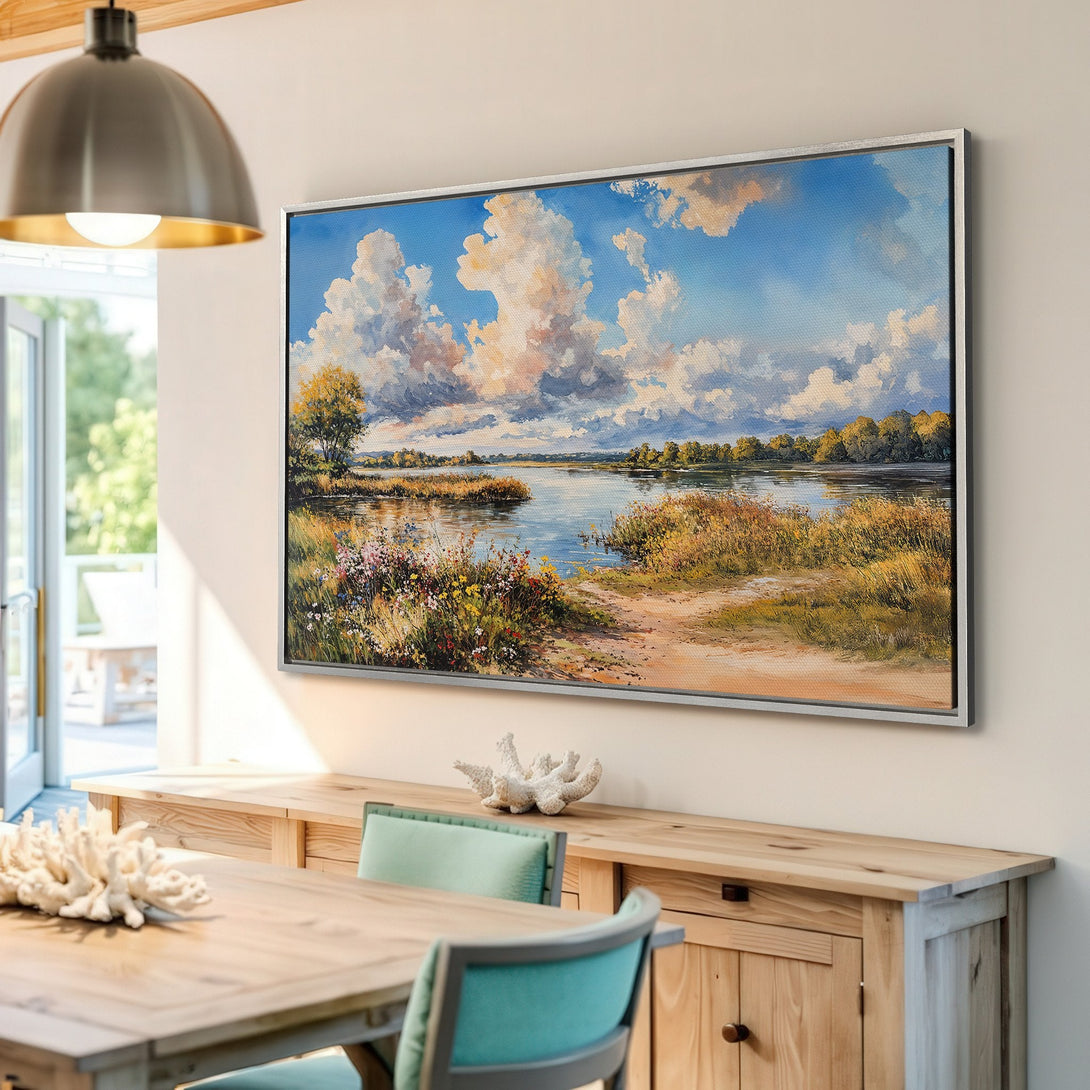 Framed Wall Art: Landscape Canvas Print with a serene lake scene, featuring blue skies, fluffy clouds, and warm, earthy tones. Perfect for home decor.