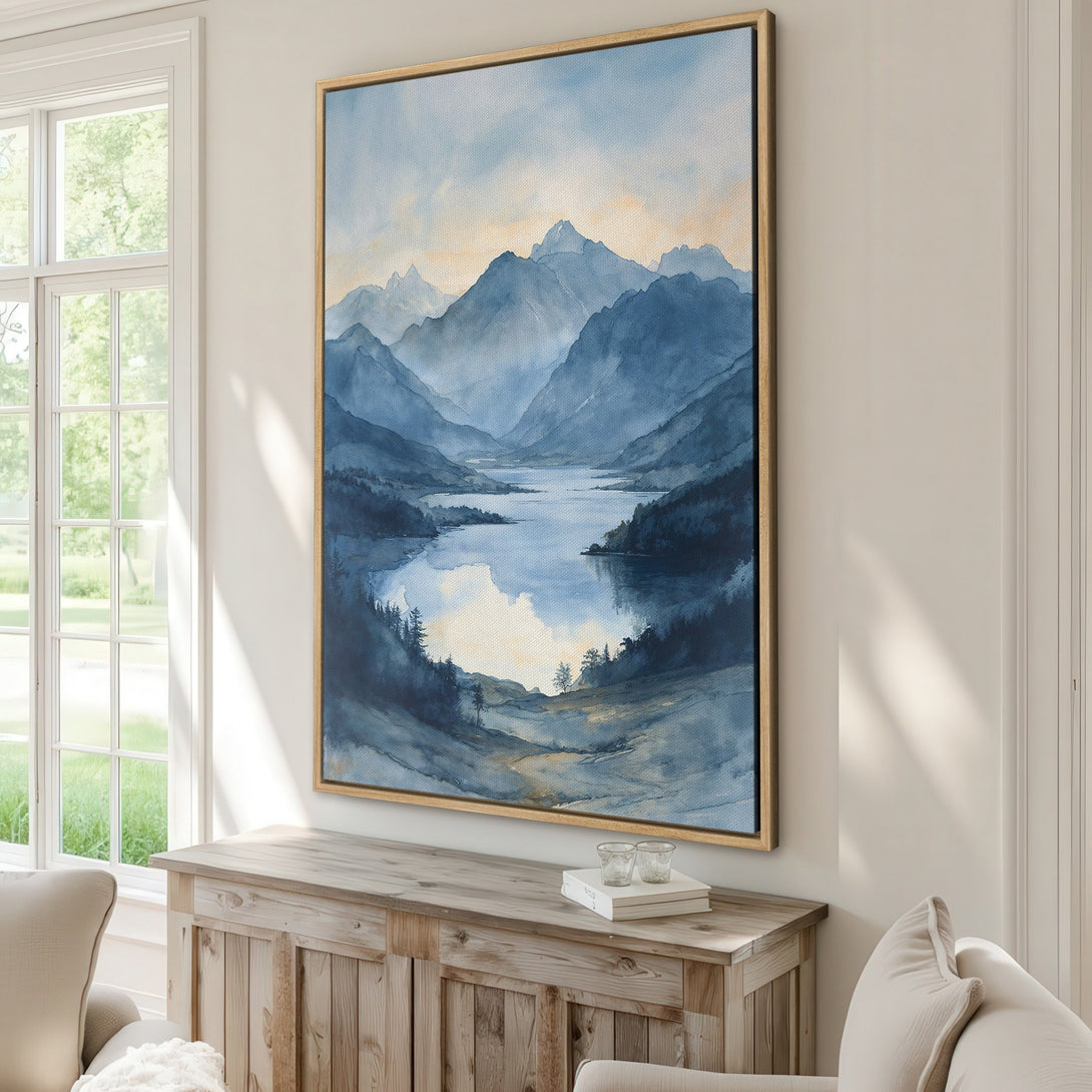 Framed Wall Art featuring a serene watercolor landscape of mountains and a lake, in a calming blue and gold palette. Perfect for adding a touch of nature to your home.
