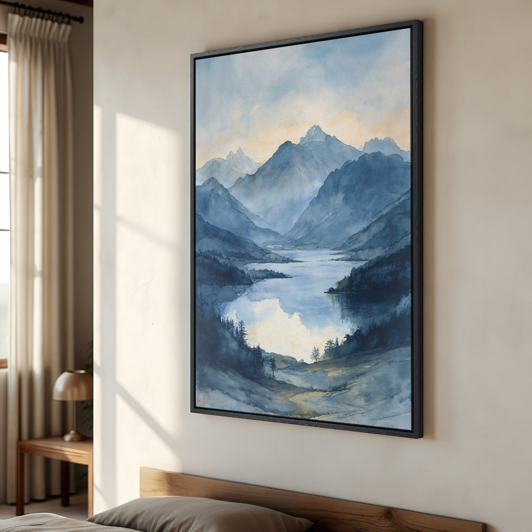 Framed Wall Art of a serene mountain lake scene in watercolor style. Blue and muted gold color palette creates a calming atmosphere for any space.