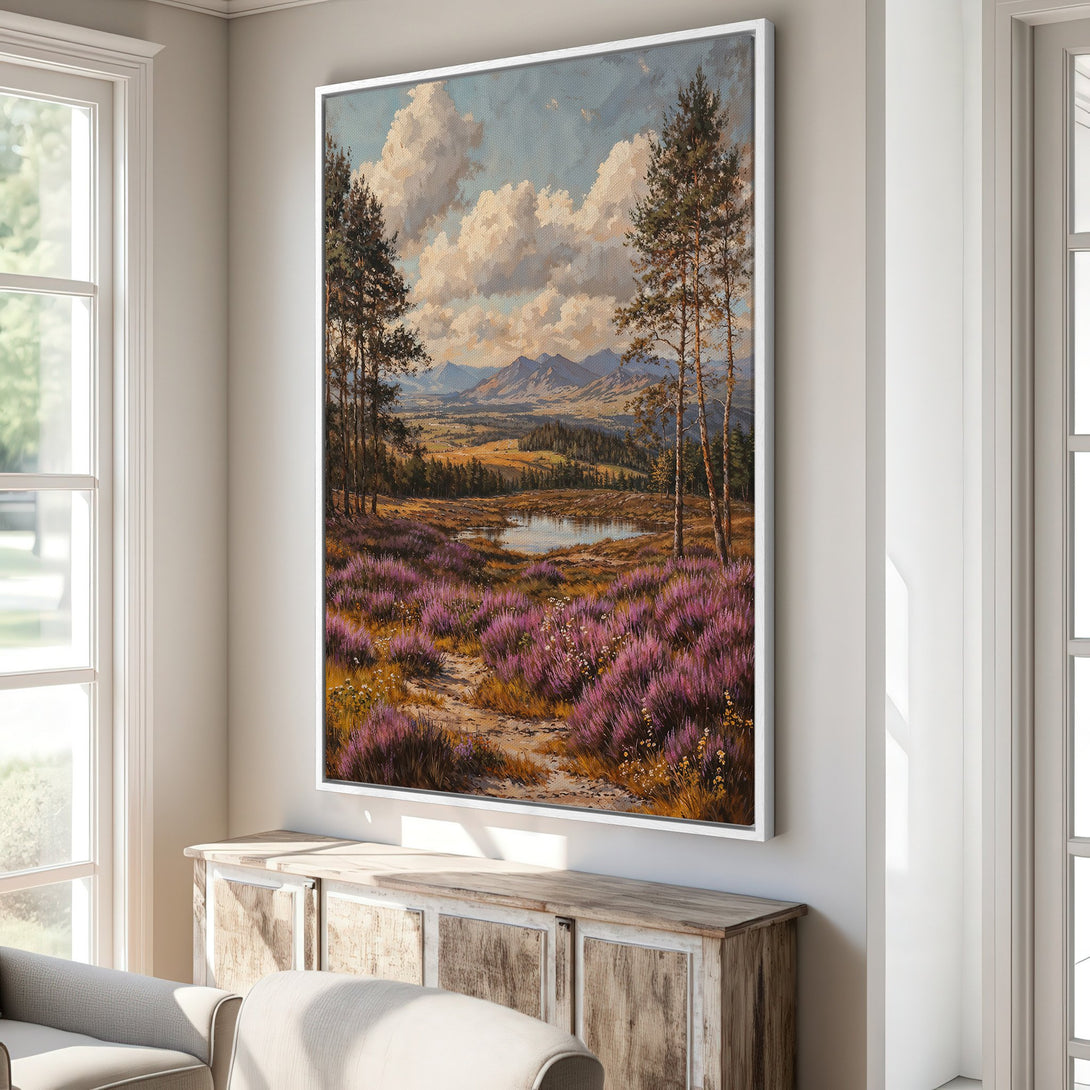 Framed Wall Art: Landscape Canvas Print with a serene meadow scene. Features purple heather, trees, and mountains. Earthy tones with blue sky. Perfect home decor!