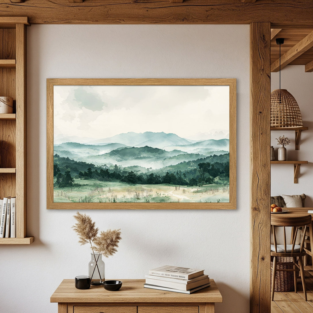 Framed Poster of a serene mountain landscape in watercolor style, featuring a calming green and blue color palette. Perfect wall art!