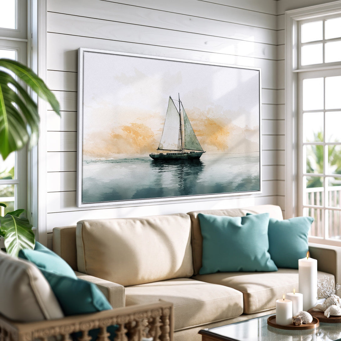Framed Wall Art featuring a sailboat on water, in a watercolor style. Coastal decor with a calming blue and gold color palette, perfect for any living room.