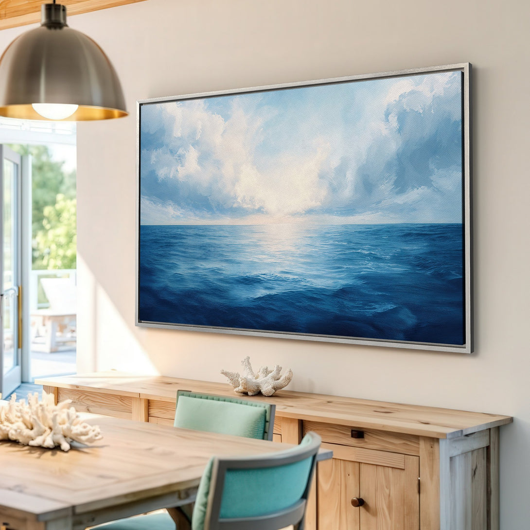 Framed Wall Art: Ocean waves canvas print in a coastal interior. Blue and white seascape art to brighten your home.