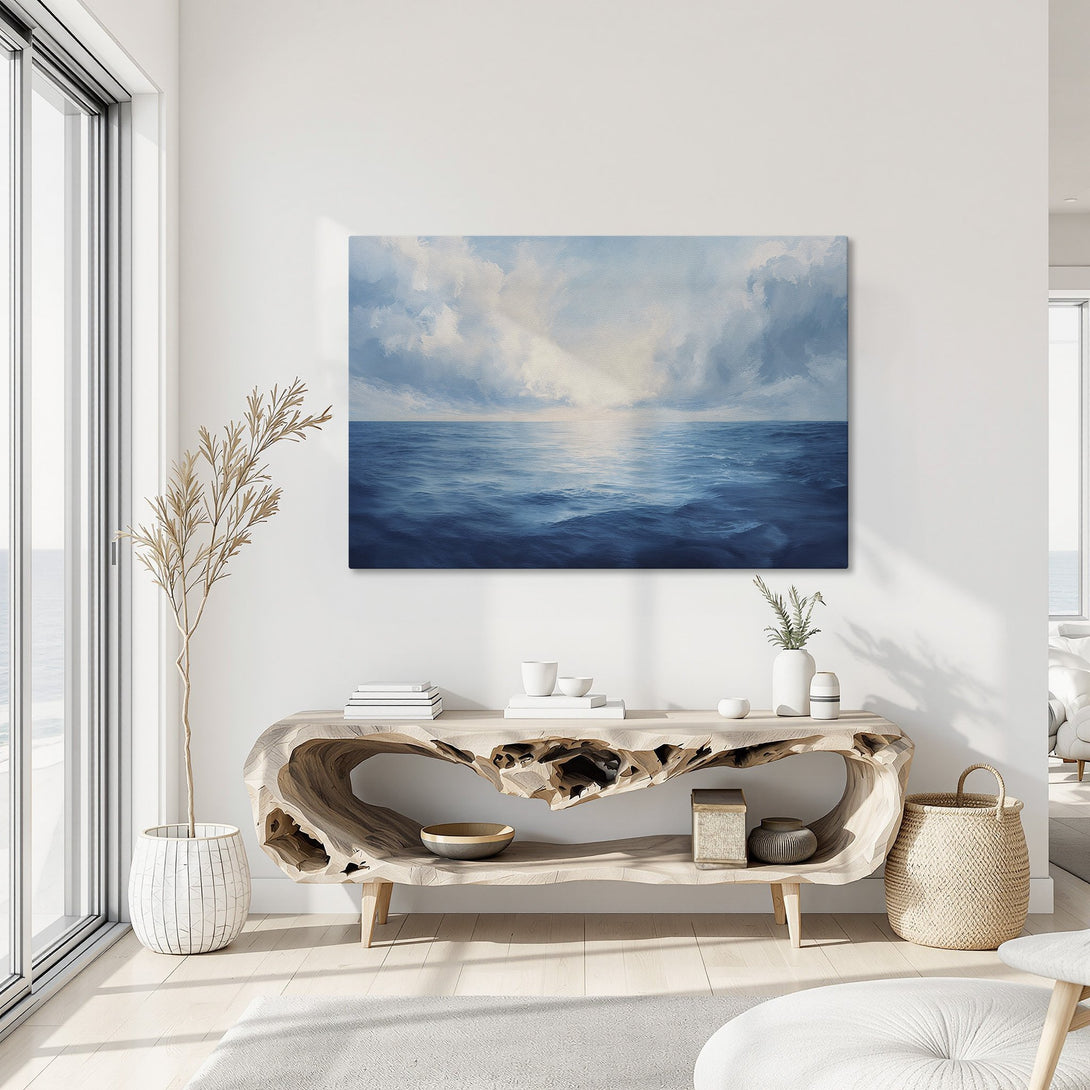 Framed Wall Art of ocean scene in a modern interior. Blue and white seascape canvas print with gold frame, perfect for coastal decor.
