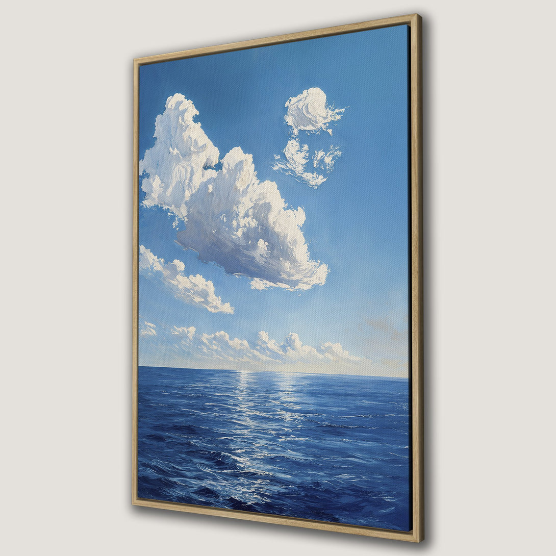 Framed Wall Art of a serene seascape with blue ocean, sky, and fluffy white clouds. Impressionistic style, perfect for adding a calming touch to any room.