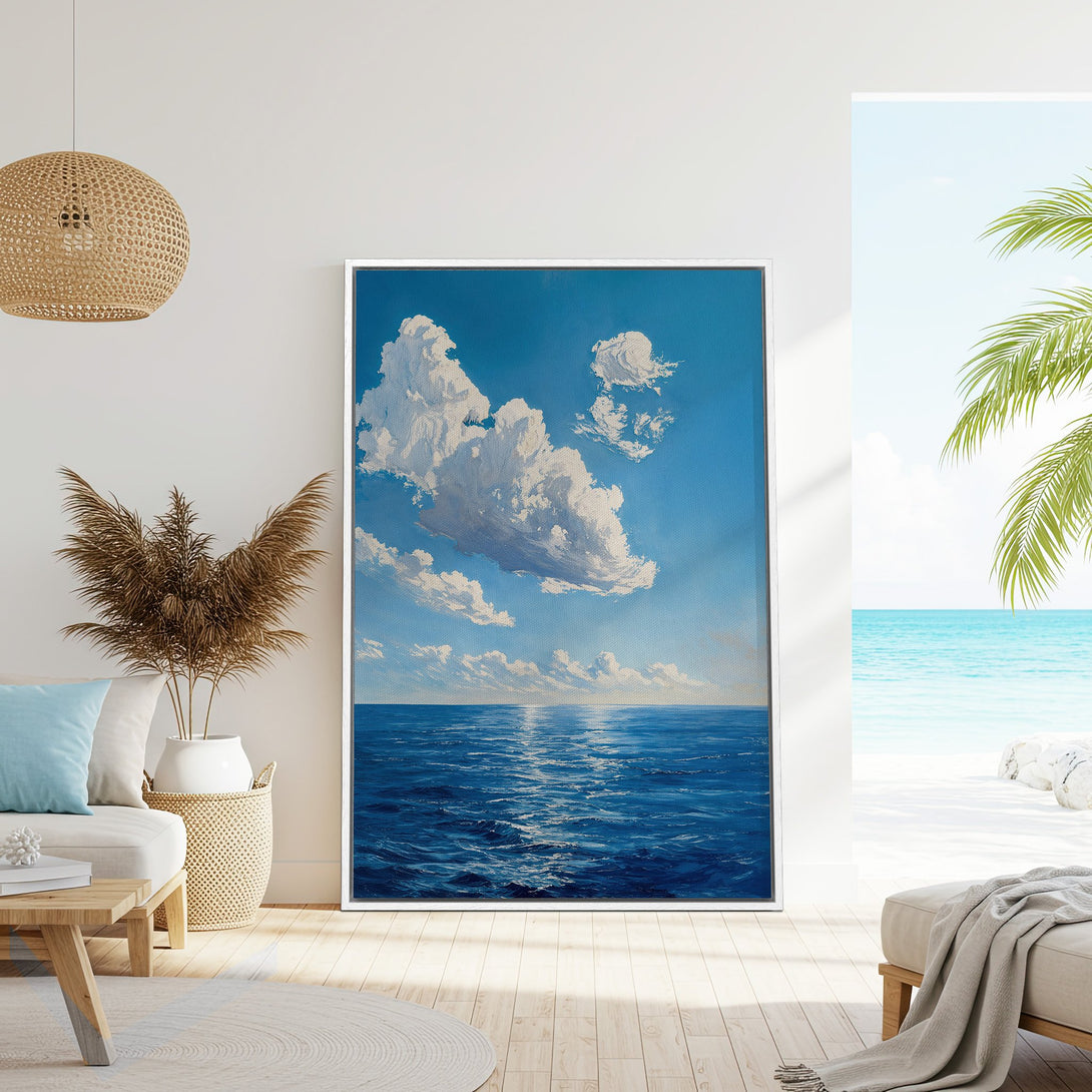Framed Wall Art featuring a serene ocean and cloudscape in a calming blue and white palette. Coastal art perfect for any home.