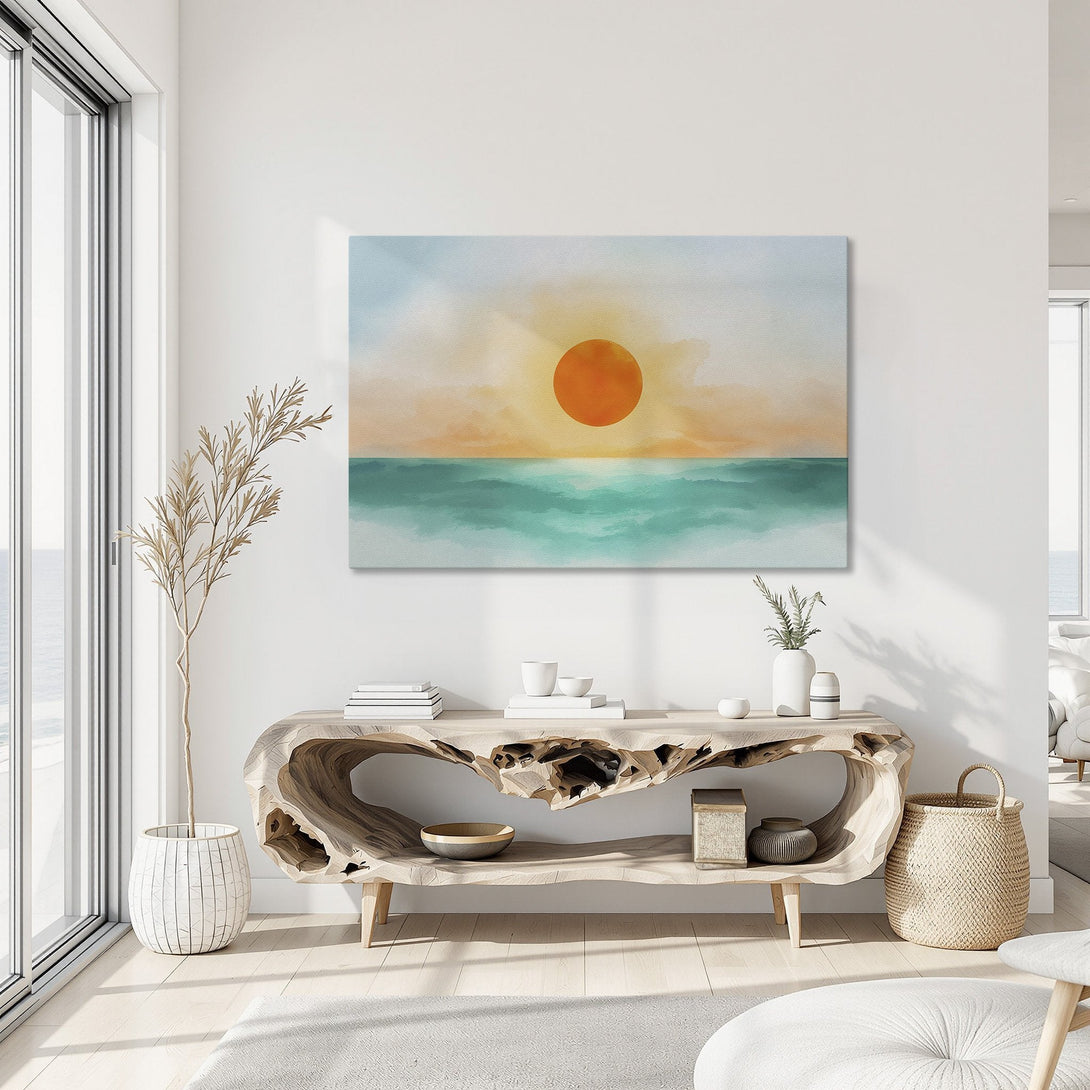 Framed Wall Art featuring a sunset over the ocean in watercolor style. Warm orange, teal, and blue color palette. Perfect coastal decor for your home.