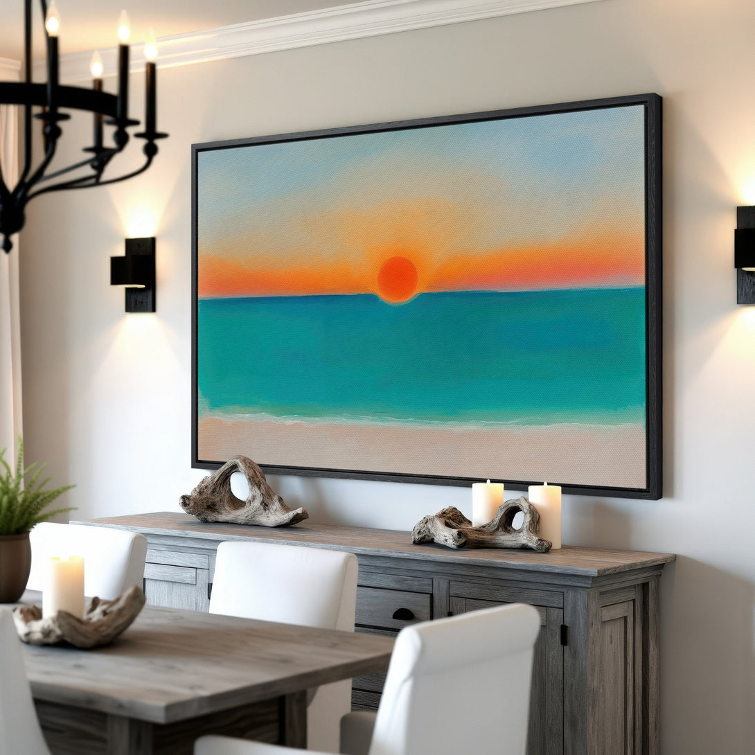 Framed Wall Art of a sunset over the ocean, with turquoise, orange, and blue hues. Coastal style Canvas Print adds a calming touch to any room.