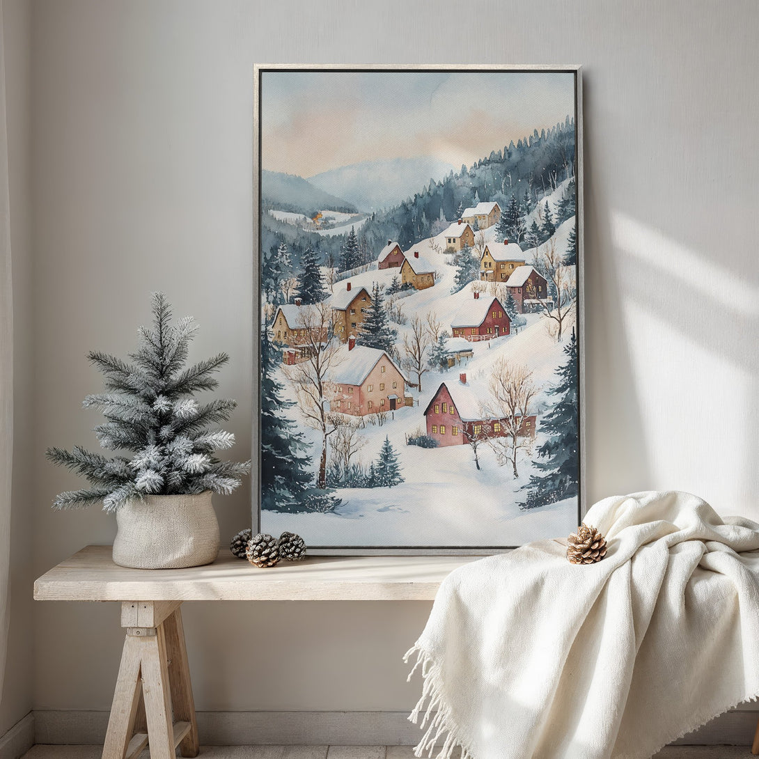 Framed Wall Art: Watercolor winter landscape of snow-covered village. Soft blues, greens, and warm tones create a cozy, inviting atmosphere. Perfect for home decor.